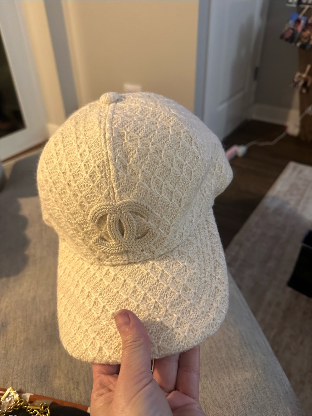 CHANEL Cream Quilted Tweed Cap with Raised CC Emblem